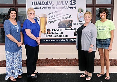 NewsTribune photo/Scott AndersonLostant Grade School will benefit from the July 13 Concert for a Cause featuring Thomas Rhett and Cole Swindell. Pictured (from left) are reading specialist Angela Wenskunas, school board president Dianna Ioerger, superintendent Sandra Malahy and Lou’s LaGrotto co-owner Merry Noonan. The school will use the concert proceeds to help with new chapter and novel books.